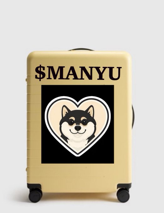 A cream-colored suitcase featuring a $MANYU meme coin design with a Shiba Inu dog illustration inside a heart on a black background.