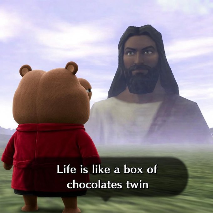 A meme showing a 3D-rendered bear character in a red robe looking up at a giant image of Jesus, with the caption 'Life is like a box of chocolates twin' referencing the famous Forrest Gump quote.
