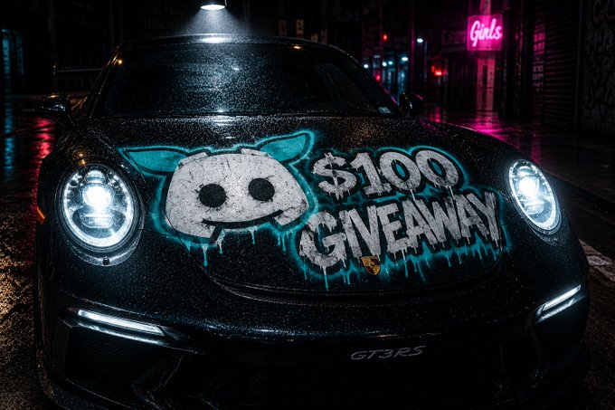 A black Porsche GT3RS covered in graffiti reading '$100 GIVEAWAY' alongside a cartoon character, parked on a wet street at night under neon signs.