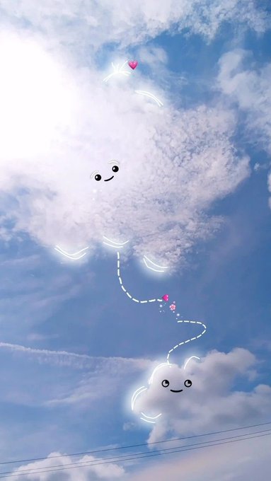 A whimsical photograph of a cloudy blue sky decorated with cute digital doodles, featuring smiling cloud faces, sparkling lines, and a heart connected by a dashed trail.