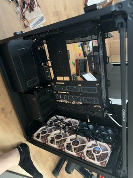 This image shows an open computer case with multiple fans, likely for a powerful build. This setup can be used for various tasks like running local AI, encrypting data with PGP, or exploring concepts like Bitcoin and Ethereum, all supporting the idea of "study freedom."