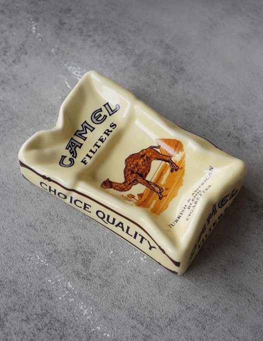 A ceramic Camel cigarette ashtray with 'CAMEL FILTERS' and 'CHOICE QUALITY' text and the iconic camel illustration, made in Turkey.