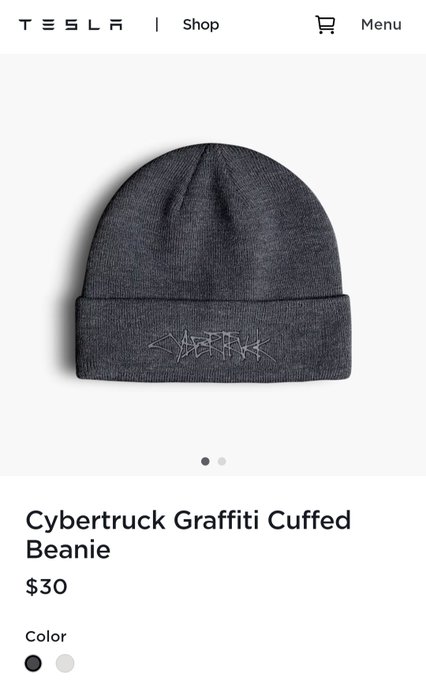 A Tesla Shop product page featuring the 'Cybertruck Graffiti Cuffed Beanie' for $30, shown in dark gray with available color options including gray and white.