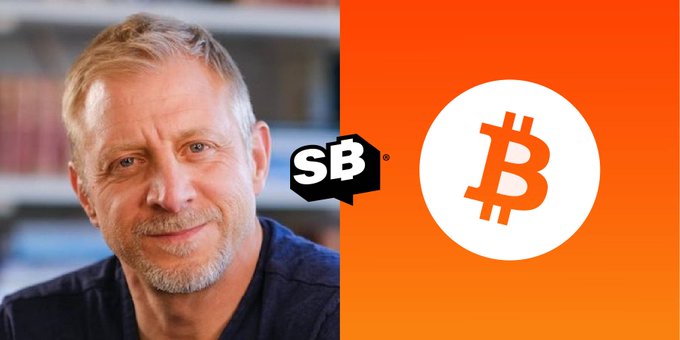 A man pictured next to an "SB" logo and a Bitcoin (₿) symbol on an orange background.