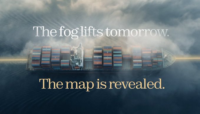 An aerial view of a large cargo ship in foggy waters with overlaid text reading 'The fog lifts tomorrow. The map is revealed.'