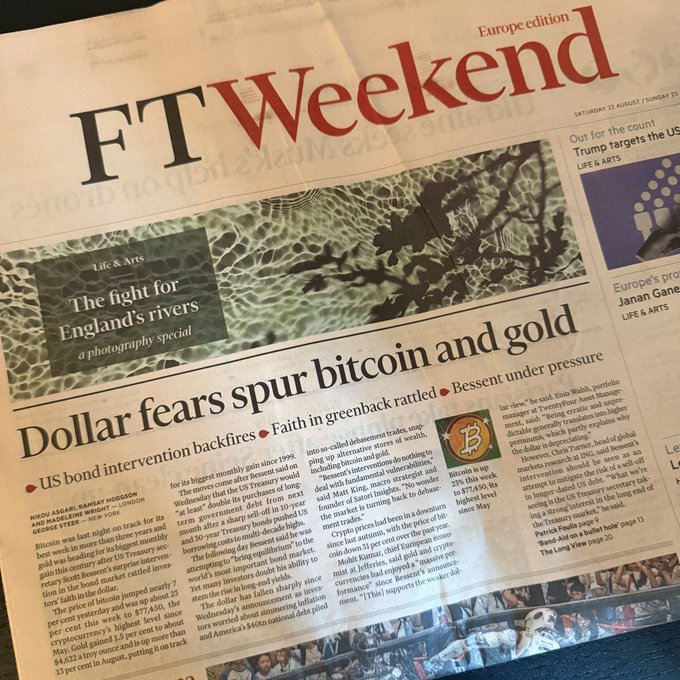 The FT Weekend front page features a large headline "Dollar fears spur bitcoin and gold" with subheading noting "Bitcoin is up 23% this week to $77,144, its highest level since May," directly illustrating the accompanying post about crypto's surge and mainstream financial coverage—though rather than mansions in Ibiza, the article focuses on Bitcoin reaching new highs amid US dollar concerns and "crypto bros" snapping up UK country estates and gold Krugerrands.