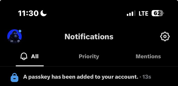 A mobile notifications screen at 11:30 PM showing a new alert: 'A passkey has been added to your account.' received 13 seconds ago.
