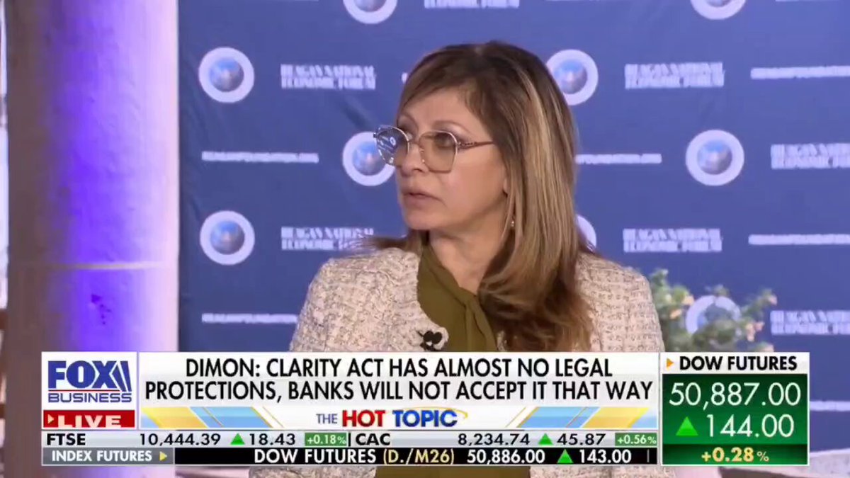 The image is a screenshot of a news program or article related to cryptocurrency like Ethereum. There are two women featured prominently in the center of the frame - one woman wearing glasses, possibly an expert or reporter, and another woman who appears to be a crypto enthusiast or someone interested in the topic being discussed. The background features various elements such as text, logos, and logos from banks, indicating that this might be a financial news program discussing the potential impact of Ethereum on traditional banking systems. The image is accompanied by a quote about the hot tip, suggesting that it is an expert's opinion or analysis related to the current topic being discussed in the program.