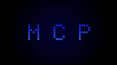 The image features a large, blue-lit sign with the word "NGL" written in white letters. The letters are arranged in a grid pattern, creating an interesting visual effect against the dark background. The text appears to be floating or hovering above the image, adding depth and dimension to the overall composition.
