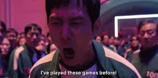 The image shows a man from the show Squid Game (played by actor Wi Ha-joon) with his mouth wide open in shock, shouting the caption "I've played these games before!" The meme humorously references the post about being the "Number 2 stock dex," implying overconfidence or experience in the "game" of trading, only to face a shocking revelation or loss.