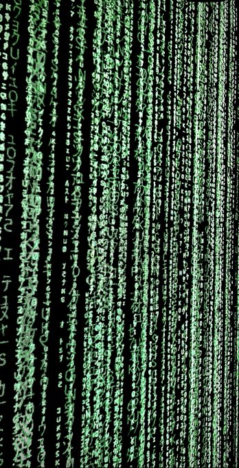 A stylized image depicting the 'digital rain' effect from The Matrix, with cascading green characters and symbols flowing vertically down a black background.