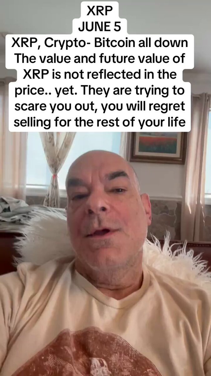The image features a man wearing a white shirt sitting down with his head resting against a pillow, possibly watching TV or reading something. The text displayed at the bottom of the image reads "XRP JUNE 5 XRP is being brought down again by Iran, and Bitcoin. They want to scare you out, yet. . . they are trying to scare you out, you will regret selling for the rest of your life". This message seems to be related to a post about cryptocurrency or blockchain on social media platforms.