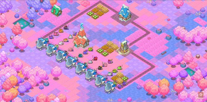 Colorful isometric view of a candy-themed village or farm game with pink and purple trees, crops, small characters, and buildings arranged on a checkered landscape.