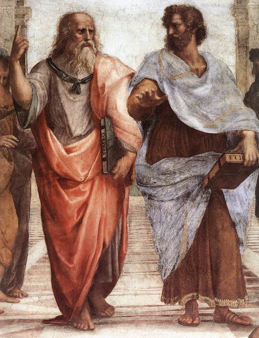 A Renaissance fresco depicts two bearded philosophers in classical robes—the left figure in orange-red robes pointing upward and holding a book, while the right figure in blue robes gestures with his hand and holds a brown book with 'ETI' visible on the spine.