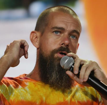 Jack Dorsey, sporting his signature long beard and tie-dye shirt, speaks into a microphone while gesturing with his hand. The image accompanies his quote questioning Bitcoin's potential as merely "digital gold," suggesting he envisions a more transformative role for the cryptocurrency—aligning with the post's argument about Bitcoin offering financial freedom amid hyperinflation in countries like Argentina and Turkey.