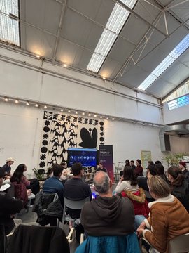 Attendees gather at an Arc community meetup in Buenos Aires, with the "Arc x BuFi" banner displayed prominently on stage, complementing the featured co-hosted event by Criptopoeta and the BuFi Global community.