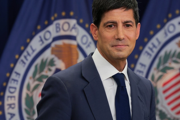 Former Federal Reserve Governor Kevin Warsh, shown here during his time at the Federal Reserve Board of Governors, is featured in relation to commentary suggesting that despite a recent rate hike, interest rates remain insufficiently restrictive, supporting market bets on further increases at the October FOMC meeting.