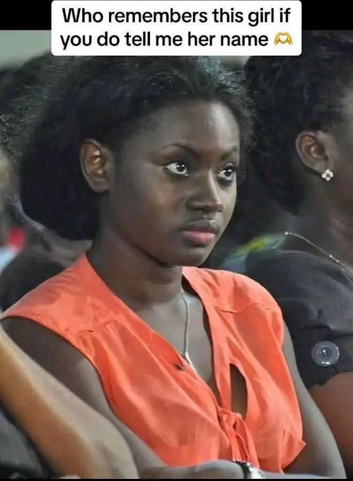 A social media screenshot asking "Who remembers this girl if you do tell me her name" showing a woman with dark curly hair wearing an orange sleeveless top, sitting in what appears to be an audience setting.