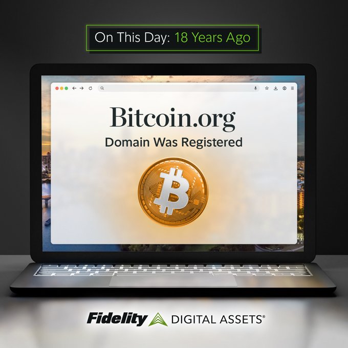 A Fidelity Digital Assets graphic showing a laptop displaying 'Bitcoin.org Domain Was Registered' with a gold Bitcoin coin, topped by a banner reading 'On This Day: 18 Years Ago' and the Fidelity Digital Assets logo at the bottom.