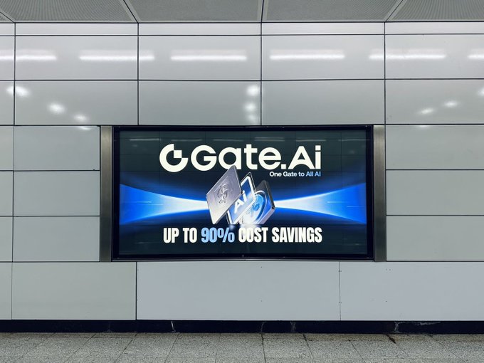 A digital advertisement for "Gate.Ai" displaying "One Gate to All AI" and "UP TO 90% COST SAVINGS" is mounted on a tiled wall, while Ric appears to be promoting his services as a problem-solver for Gate.Ai customers alongside a discussion of Bitcoin's top performance ranking.