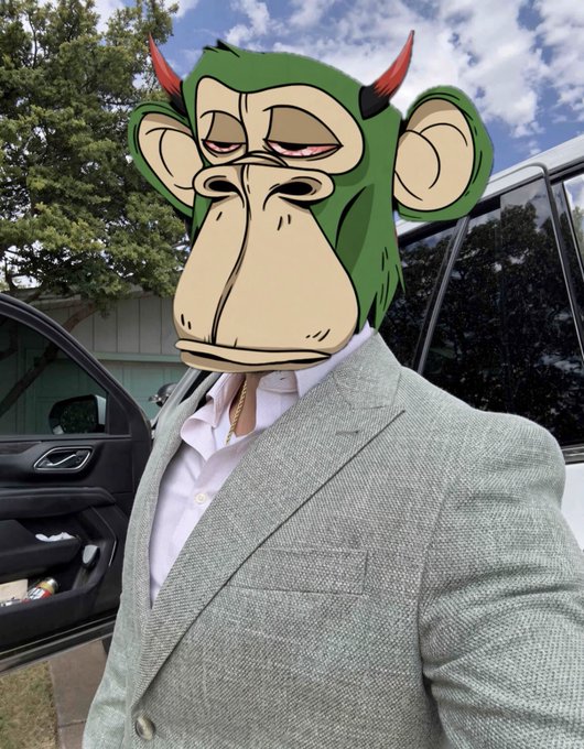 Person wearing a light green blazer over a white shirt with a cartoon green monkey head filter applied to their face.