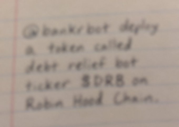 Handwritten text reading: 'bankrupt during a token called debt relief but ticker $DRB on Robin Hood Chain.'