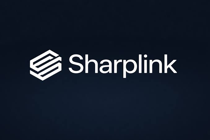 The image displays the Sharplink logo, featuring a stylized white hexagonal icon next to the company name "Sharplink" on a dark background. The logo corresponds to the Ethereum treasury management company mentioned in the post, which recently made its first Ethereum purchase in eight months by acquiring 5,000 ETH worth $7.85 million.