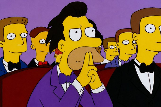 The image features a group of cartoon characters, including a man wearing a purple suit and bow tie sitting next to another man dressed in a black suit and tuxedo. The man in the purple suit has his hand over his mouth with his fingers interlocked, while the other man is looking at him. A third character can be seen in the background, but it's unclear what they are doing or why they're there.

The image also includes a text that reads "Dudes with $100 in Bitcoin monitoring the situation like". This suggests that the characters might be discussing something related to Bitcoin and cryptocurrency, possibly as part of a conversation about investing or financial matters.