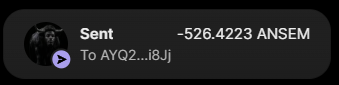 A curved screen displays a cryptocurrency transaction confirming a $100 transfer of $ANSEM tokens sent to the wallet address "AYQ2...8J" (referenced in the post as the recipient of the first round 2 airdrop). The transaction details show a fee of 526.4223 $ANSEM alongside the send confirmation.