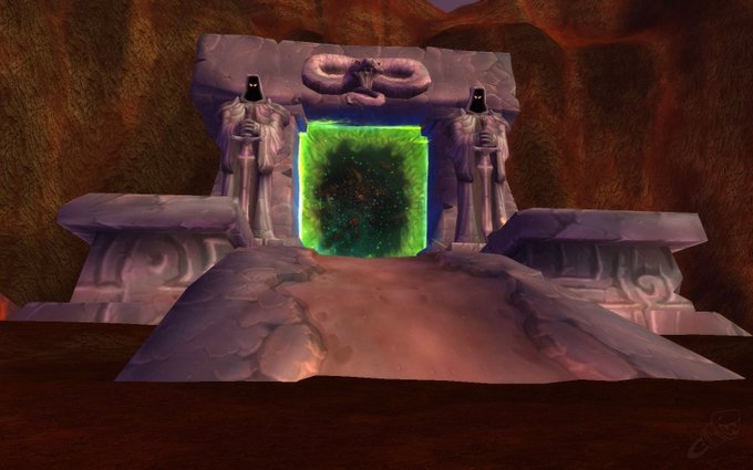 A 3D-rendered scene featuring a glowing green portal flanked by two hooded stone statues on a platform within a cavernous environment.