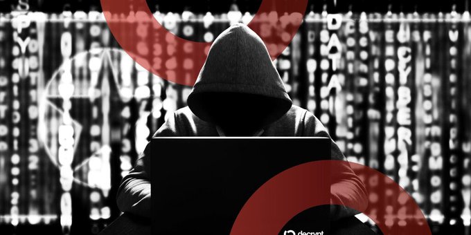 An image of a hooded figure typing on a laptop against a backdrop of falling digital characters, overlaid with a red 'no entry' or prohibited symbol.