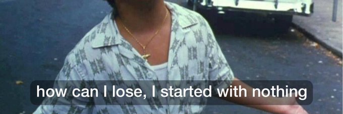A vintage-style photo shows a person from the neck down wearing a patterned shirt and a gold cross necklace, with a meme caption overlaid in white text reading 'how can I lose, I started with nothing'.