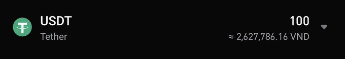 A dark interface showing 'USDT Tether' cryptocurrency with 100 units, valued at approximately 2,627,786.16 VND.