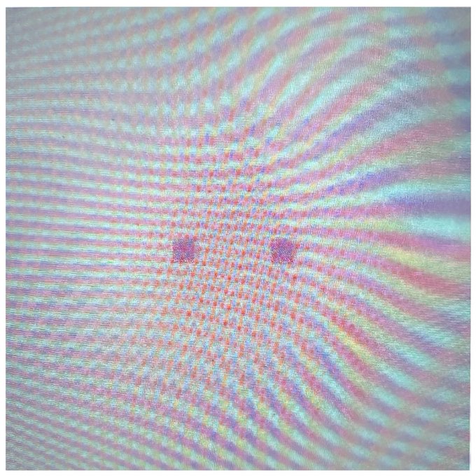 A digital portrait of CryptoPunk #005 features a pixelated face rendered in a wavy, iridescent texture of pastel rainbow colors radiating outward from the center.