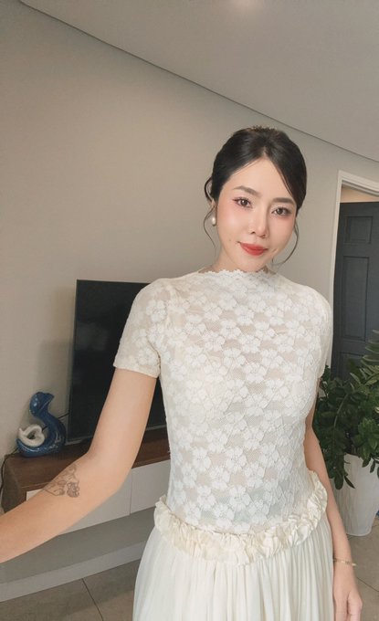 In the image, a woman in a white lace top and dress. This evokes a Cinderella-like image, making it fitting for a post encouraging someone to shift from a professional role ("BD OKX") to a more whimsical, fairy-tale persona.