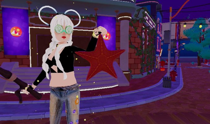 A 3D avatar screenshot showing a stylized female character with white hair, cucumber eye mask, and black top, holding a large red star ornament in a nighttime virtual environment.