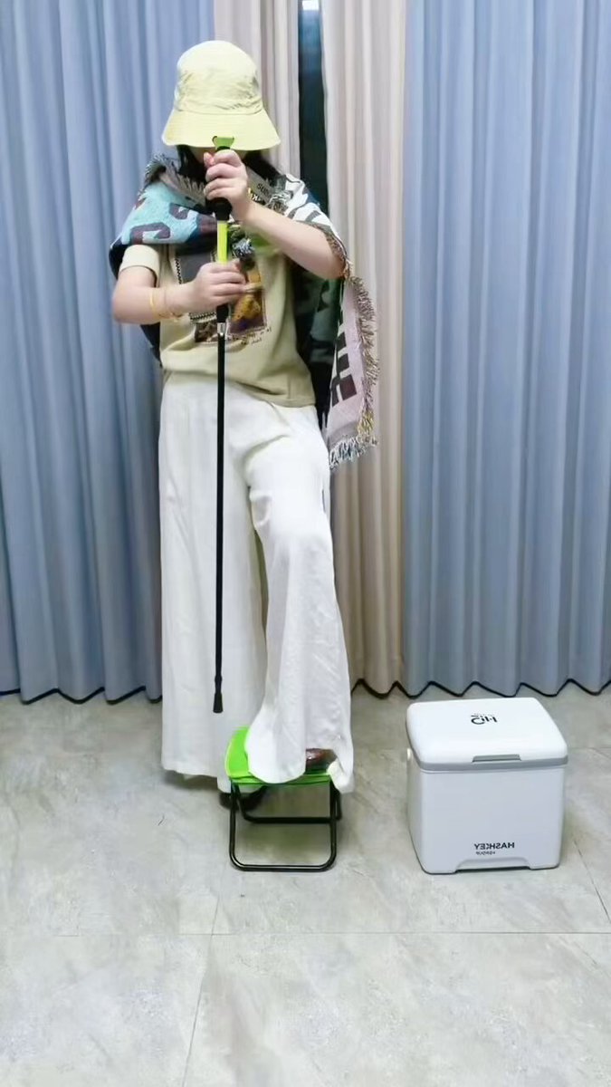The image features a person standing next to a white cooler, possibly preparing for an outdoor event or camping trip. The person appears to be wearing a hat and holding a paddle, which could indicate that they are involved in water-related activities such as canoeing or kayaking. The scene suggests that the person is excited about their upcoming adventure and wants to ensure they have all the necessary equipment and supplies for their journey.