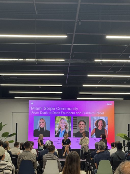 A photograph of a 'Miami Stripe Community' event showing a panel discussion titled 'From Deck to Deal: Founders and Funders Panel' with four speakers pictured on a large screen above the stage.