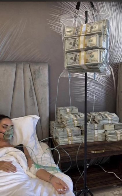 A satirical image showing a person in a hospital bed with an oxygen mask and IV, next to an IV drip bag filled with stacks of hundred-dollar bills, with more money piled on a bedside table.