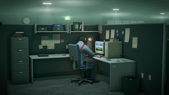A game-style office scene shows a seated worker at a desk with a computer, desk lamp, cabinets, pinned notes, shelves, and a wall clock.