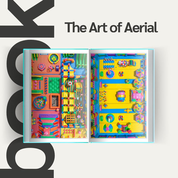 The image features an open book displaying vibrant, colorful aerial photography of what appears to be an amusement park or playground, alongside bold black text reading "The Art of Aerial" and "LOOK" running vertically. The accompanying post highlights this as a coffee table book by @cafromthesky, now available as an NFT on the SuperRare platform, showcasing the satisfying nature of aerial-view artistic photography.