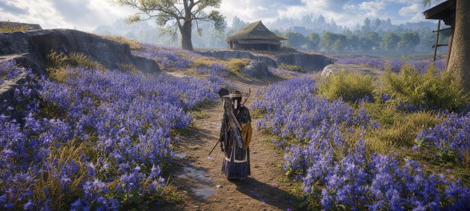 A digital artwork or video game scene shows a figure in a wide-brimmed hat and long coat walking down a dirt path through a field of purple flowers, with a thatched-roof hut in the background.