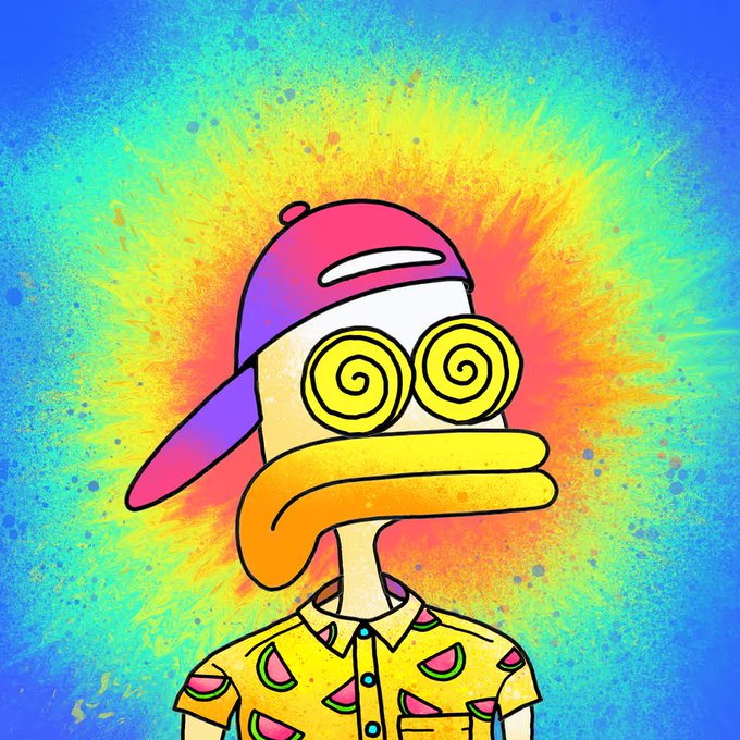 A cartoon duck character with hypnotic spiral eyes, an orange beak, and a pink-and-purple backwards cap stands against a vibrant tie-dye burst background of blue, yellow, and orange hues, wearing a yellow shirt patterned with pink watermelon slices. The image's psychedelic, dizzy aesthetic and dazed expression perfectly match the post's playful caption about riding with SupDucks, reinforcing the surreal, "trippy" vibe while there is no visible text or branding beyond the implied SupDucks collaboration referenced in the caption.