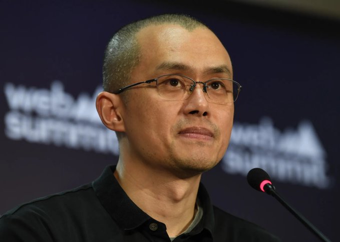 A photograph of a man with glasses wearing a black polo shirt, speaking into a microphone at the 'Web3 Summit', with the event branding visible in the background.