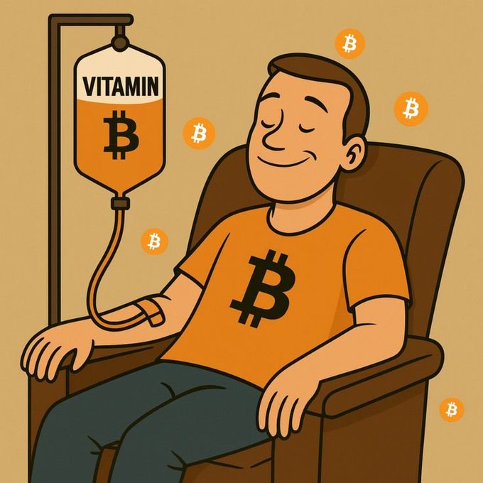 The image features a man sitting comfortably in a chair, wearing an orange shirt with a Bitcoin symbol on it. The Bitcoin symbol is located at the center of his shirt. Surrounding him are numerous Bitcoins floating in the air, creating a sense of abundance or wealth associated with the cryptocurrency. The scene also includes a vitamin IV drip being inserted into the man's arm, suggesting that he may be receiving treatment for some health issue related to the Bitcoin symbol on his shirt.