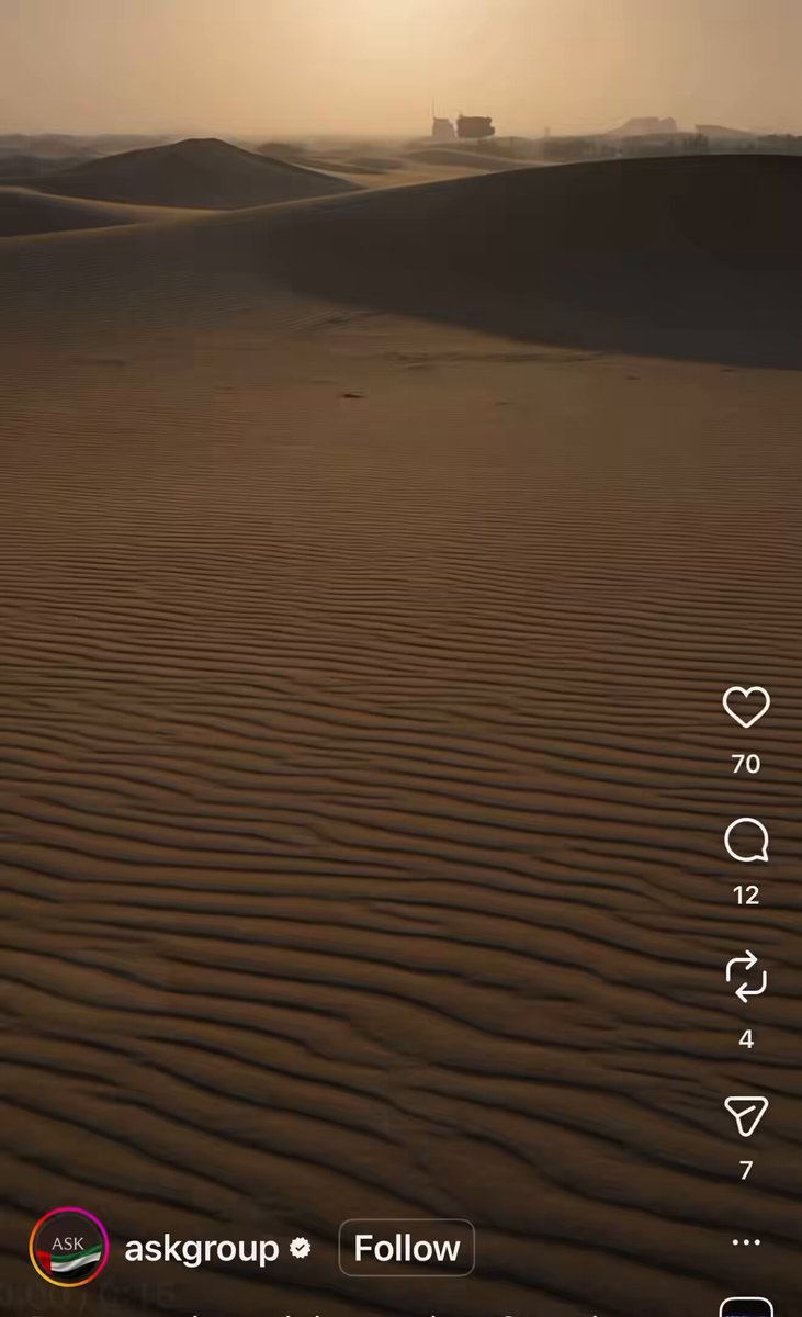 The image shows a desert landscape with sand dunes and a sunset in the background. The photo has been shared on social media, as indicated by the text "ask group" at the bottom of the image. The caption reads "Dope video @askgroupae MAJOR PARTNERSHIP ALERT $KTA and UAE - The UAE-Philippines, UAE-Pakistan, and UAE-Kenya corridors together add tens of billions more."