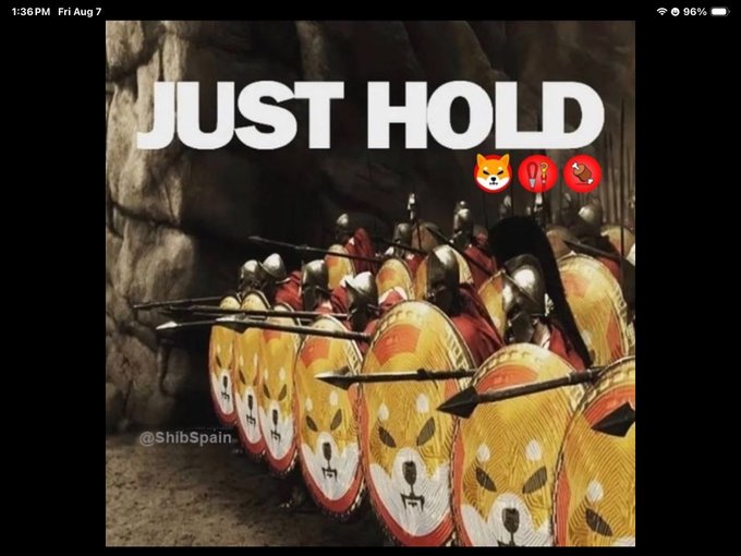 A meme showing ancient Roman-style soldiers with shields featuring Shiba Inu dog faces in a tunnel, with the text 'JUST HOLD' and '@ShibSpain'.