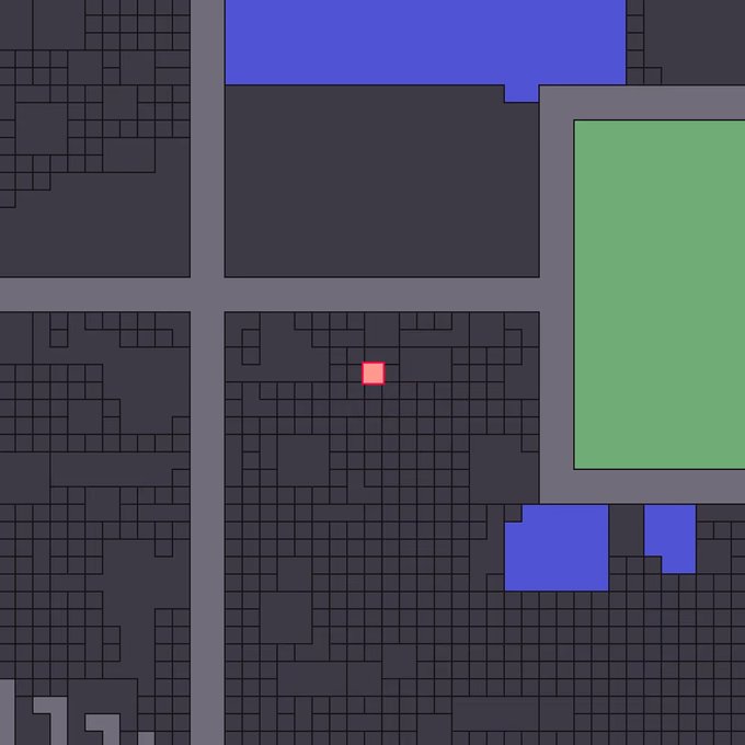 An abstract digital rendering shows dark grey grid blocks with scattered blue, green, and red geometric shapes.