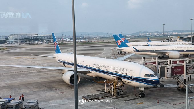 Two China Southern Airlines passenger jets are parked at airport gates, with the foreground plane bearing the airline's Chinese name and a "DJI OSMO POCKET 4" watermark.