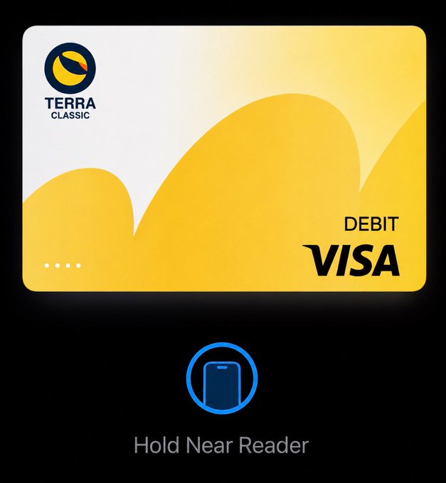 A Terra Classic (LUNC) debit Visa card shown in white and yellow with the instruction 'Hold Near Reader' below it, indicating mobile contactless use.